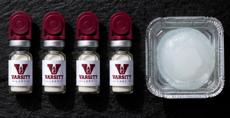 Four Varsity Labs vials next to an insulated cold pack